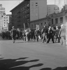 Mass meeting of WPA workers parading up Market Street, San Francisco, California , 1939. Creator: Dorothea Lange