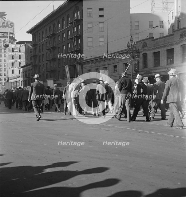 Mass meeting of WPA workers parading up Market Street, San Francisco, California , 1939. Creator: Dorothea Lange.