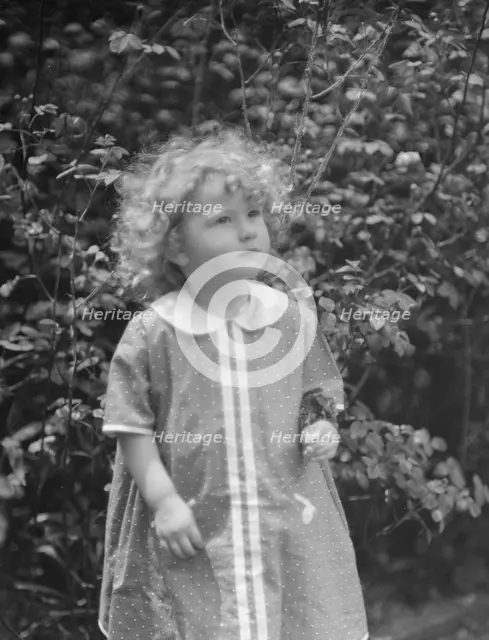 McCormick, Medill, child of, standing outdoors, 1923 May 21. Creator: Arnold Genthe.