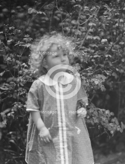 McCormick, Medill, child of, standing outdoors, 1923 May 21. Creator: Arnold Genthe.