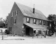 McDuff Green Warehouse in Falmouth, Stafford County, Virginia--H.G. Lightner store, c1927 - 1943. Creator: Frances Benjamin Johnston