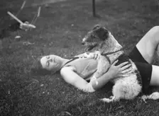 McKeogh, Arthur, Mrs., with dog, outdoors, 1927 Creator: Arnold Genthe