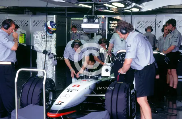 McLaren MP4 13, Mika Hakkinen in pits during practice for 1998 British Grand Prix. Creator: Unknown.