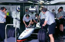 McLaren MP4 13, Mika Hakkinen in pits during practice for 1998 British Grand Prix. Creator: Unknown
