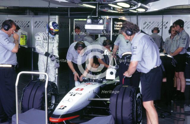 McLaren MP4 13, Mika Hakkinen in pits during practice for 1998 British Grand Prix. Creator: Unknown.