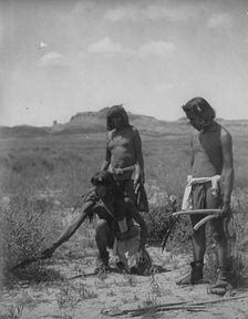 Me Sa Tawa catching snakes-Hopi, c1907. Creator: Edward Sheriff Curtis