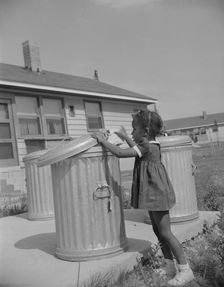 Metal ashcans, Frederick Douglass housing project, Anacostia, D.C., 1942. Creator: Gordon Parks