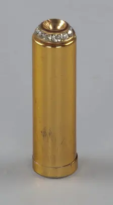 Metal lipstick holder from Mae's Millinery Shop, 1941-1994. Creator: Unknown