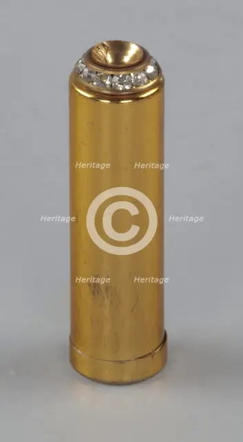 Metal lipstick holder from Mae's Millinery Shop, 1941-1994. Creator: Unknown.