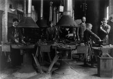 Metal shop (blacksmithing) class in a Washington, D.C., high school, (1899?). Creator: Frances Benjamin Johnston