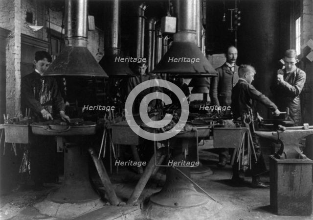 Metal shop (blacksmithing) class in a Washington, D.C., high school, (1899?). Creator: Frances Benjamin Johnston.