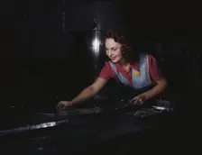 Metal parts are placed on masonite by..., North American Aviation, Inc., Inglewood, Calif., 1942. Creator: Alfred T Palmer