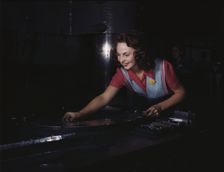 Metal parts are placed on masonite by..., North American Aviation, Inc., Inglewood, Calif., 1942. Creator: Alfred T Palmer