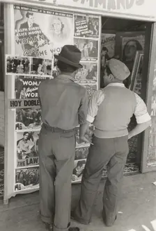 Mexican boys looking at movie poster, San Antonio, Texas, 1939-03. Creator: Russell Lee