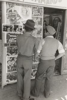 Mexican boys looking at movie poster, San Antonio, Texas, 1939-03. Creator: Russell Lee