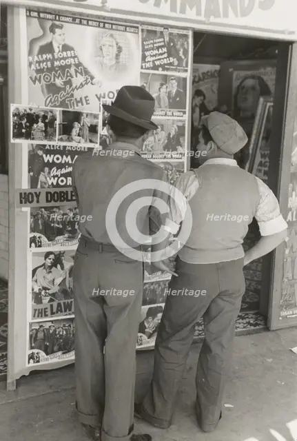 Mexican boys looking at movie poster, San Antonio, Texas,  1939-03. Creator: Russell Lee.