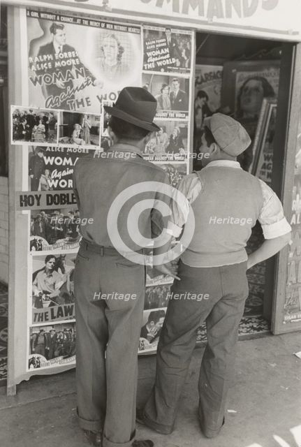 Mexican boys looking at movie poster, San Antonio, Texas,  1939-03. Creator: Russell Lee.