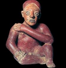 Mexican pottery figure of a squatting man, 4th century
