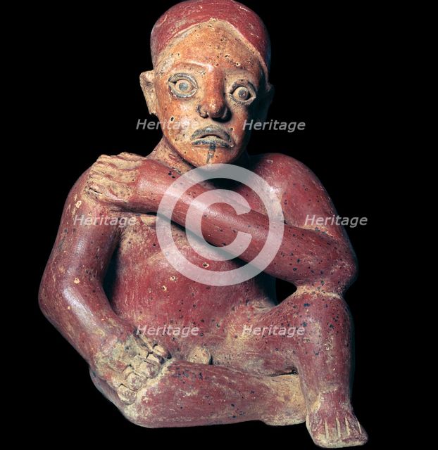 Mexican pottery figure of a squatting man, 4th century. Artist: Unknown