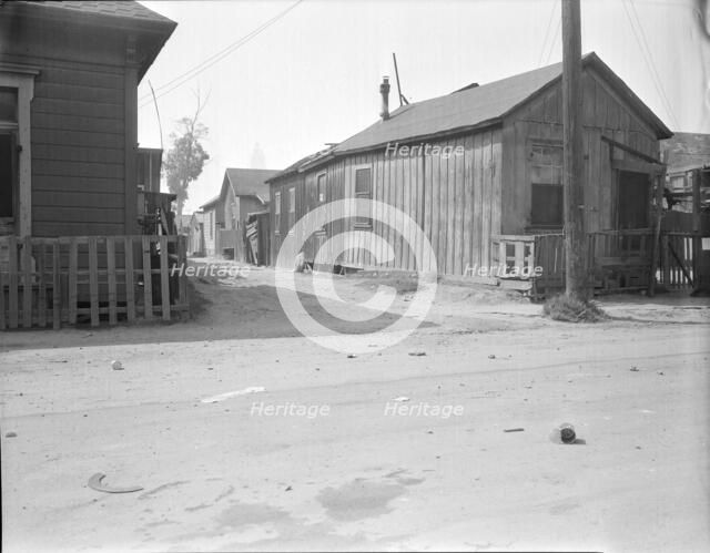 Mexican quarter of Los Angeles, one quarter mile from City Hall, California, 1936. Creator: Dorothea Lange.