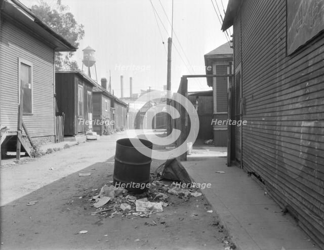 Mexican quarter of Los Angeles, one quarter mile from City Hall, California, 1936. Creator: Dorothea Lange.