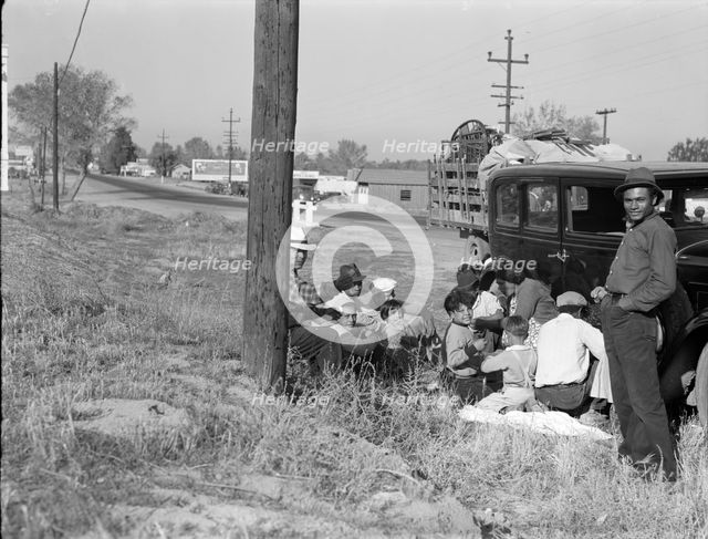 Mexicans bound for the Imperial Valley to harvest peas, near Bakersfield, California, 1936. Creator: Dorothea Lange.