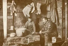 Meares and Demetri at the Blubber Stove in the Discovery Hut 3 November 1911, (1913). Artist: Herbert Ponting