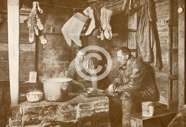 'Meares and Demetri at the Blubber Stove in the 'Discovery' Hut', 3 November 1911, (1913). Artist: Herbert Ponting.