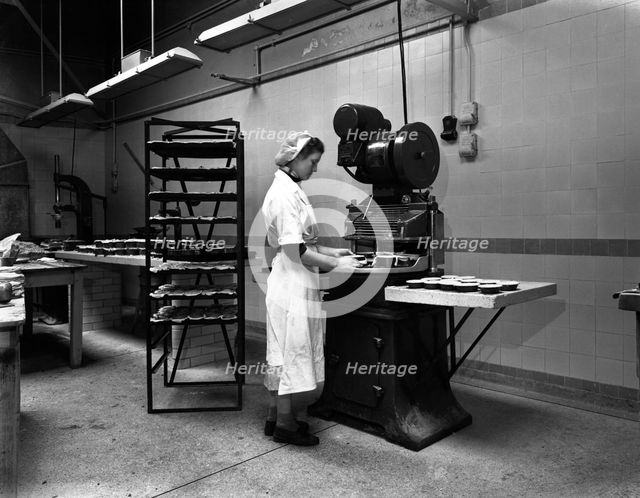 Meat pie production, Rawmarsh, South Yorkshire, 1959.  Creator: Michael Walters.