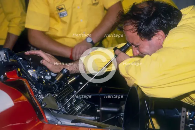 Mechanic at work in the Ferrari pits, 1988. Artist: Unknown