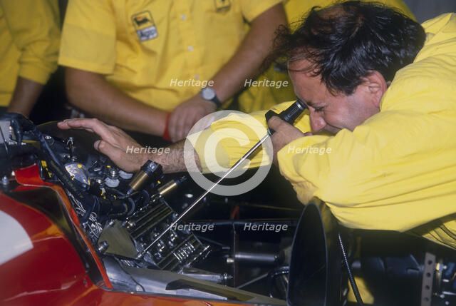 Mechanic at work in the Ferrari pits, 1988. Artist: Unknown
