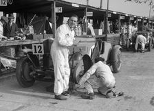 Mechanic working on a Talbot 105 at the JCC Double Twelve race, Brooklands, 8/9 May 1931. Artist: Bill Brunell