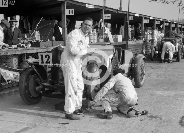 Mechanic working on a Talbot 105 at the JCC Double Twelve race, Brooklands, 8/9 May 1931. Artist: Bill Brunell.