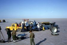 Mechanics fuelling Bluebird CN7 for World Land Speed Record attempt, Lake Eyre, 1964. Creator: Unknown