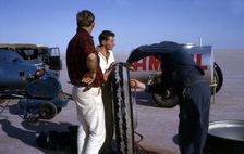 Mechanics inflating Bluebird CN7 tyre for World Land Speed Record attempt, Lake Eyre, 1964. Creator: Unknown
