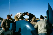 Mechanics working on Bluebird CN7 for World Land speed record attempt, Lake Eyre, 1964. Creator: Unknown