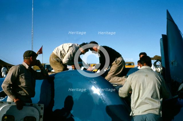 Mechanics working on Bluebird CN7 for World Land speed record attempt, Lake Eyre, 1964. Creator: Unknown.