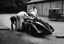 Mechanics working on Leon Cushman's Austin 7 racer for a speed record attempt, Brooklands, 1931. Artist: Bill Brunell