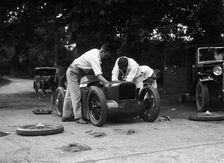 Mechanics working on Leon Cushman's Austin 7 racer for a speed record attempt, Brooklands, 1931. Artist: Bill Brunell