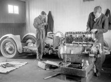Mechanics working on Raymond Mays 4500 cc Invicta car. Artist: Bill Brunell