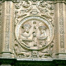 Medallion on the façade of the University of Salamanca with the relief of the Catholic Kings
