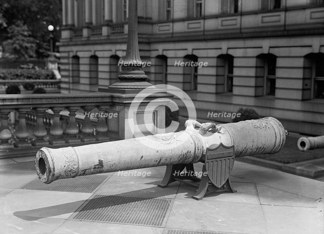 Medals, Decorations, Etc. - Spanish Gun at War Department Made Into Medals, 1917. Creator: Harris & Ewing.