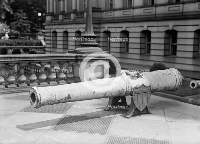 Medals, Decorations, Etc. - Spanish Gun at War Department Made Into Medals, 1917. Creator: Harris & Ewing.