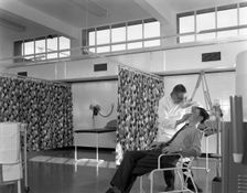 Medical care at a steelworks, Sheffield, South Yorkshire, 1963. Creator: Michael Walters