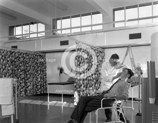 Medical care at a steelworks, Sheffield, South Yorkshire, 1963. Creator: Michael Walters.