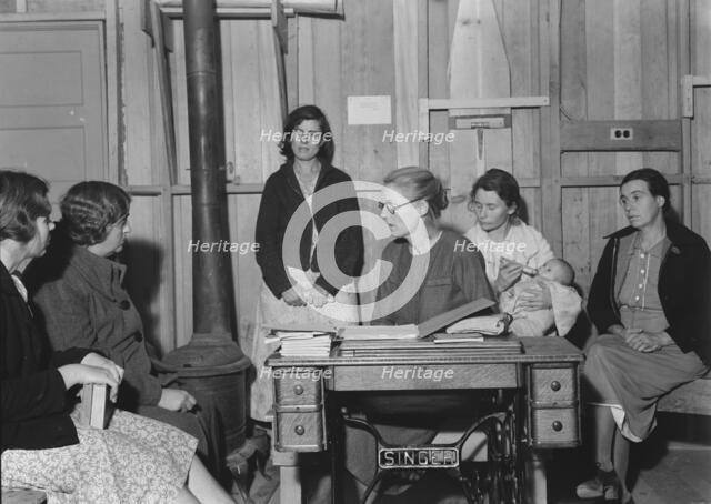 Meeting of the Mothers' Club in Arvin camp for migrant workers, Kern County, 1938. Creator: Dorothea Lange.