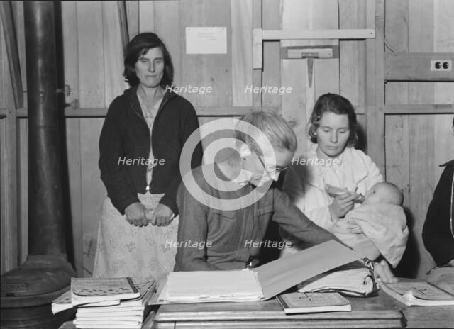 Meeting of the Mothers' Club in Arvin camp for migrant workers, Kern County, 1938. Creator: Dorothea Lange.