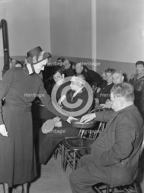 Meeting opens with taking the collection, Salvation Army, San Francisco, California, 1939. Creator: Dorothea Lange.