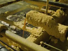 Melted sulphur from the wells pouring into relay..., Freeport Sulphur Co, Hoskins Mound, Texas, 1943 Creator: John Vachon