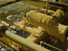 Melted sulphur from the wells pouring into relay..., Freeport Sulphur Co, Hoskins Mound, Texas, 1943 Creator: John Vachon